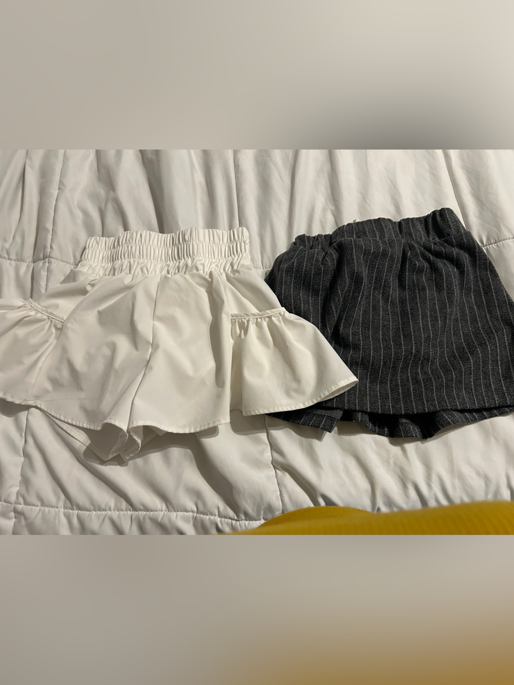 Pair of Flounce Skort Shorts in White and puma grey skirt